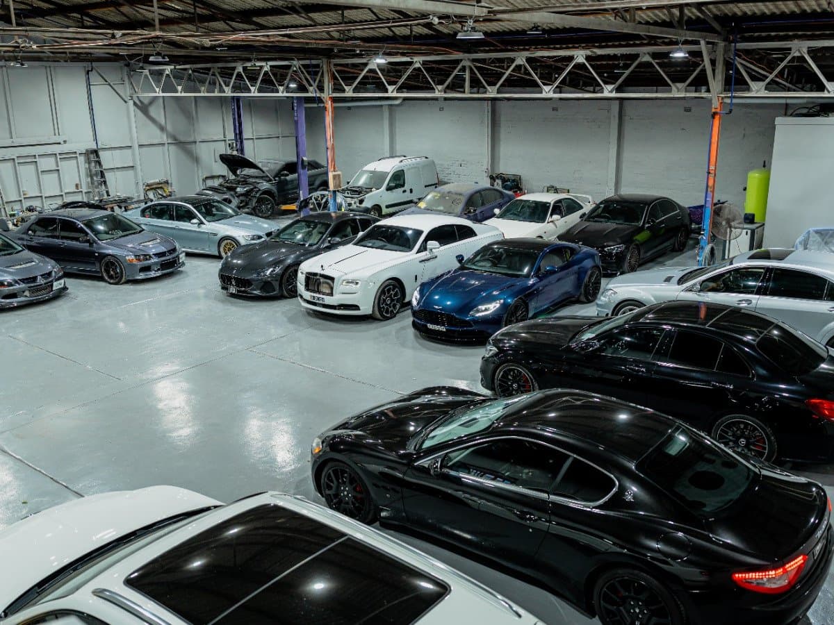 Finished prestige and classic cars on the workshop floor